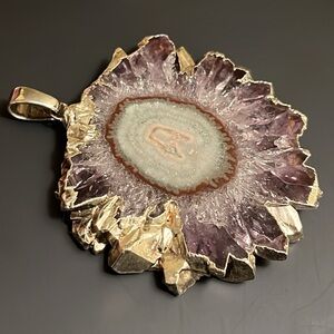 Silver-edged amethyst geode slice pendant